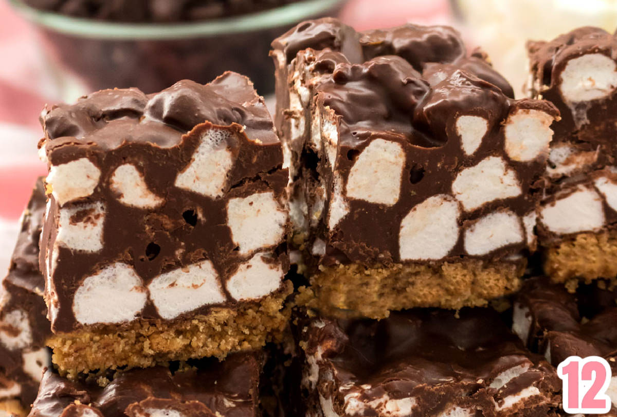 Closeup on two Chocolate Marshmallow Bars sitting on a mound of other cookie bars.