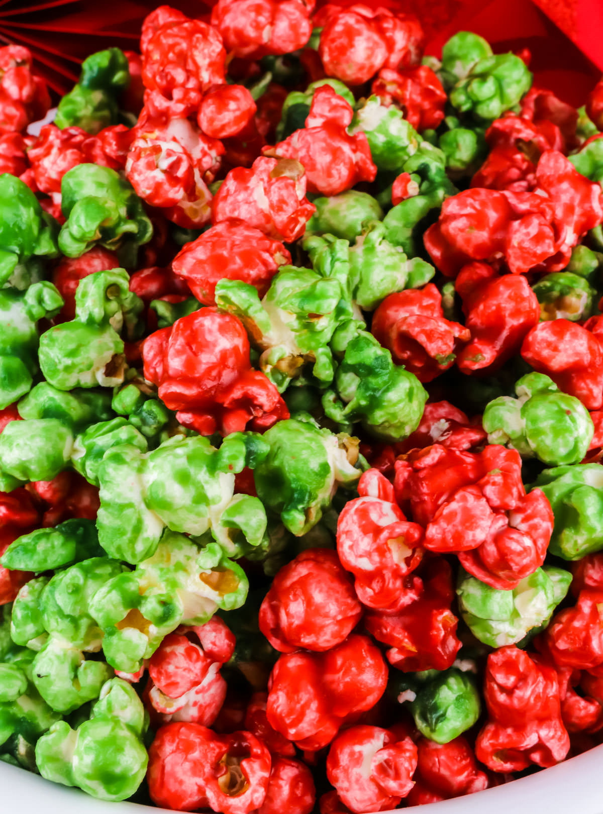 Closeup on a bowl of Red and Green Christmas Caramel Corn.
