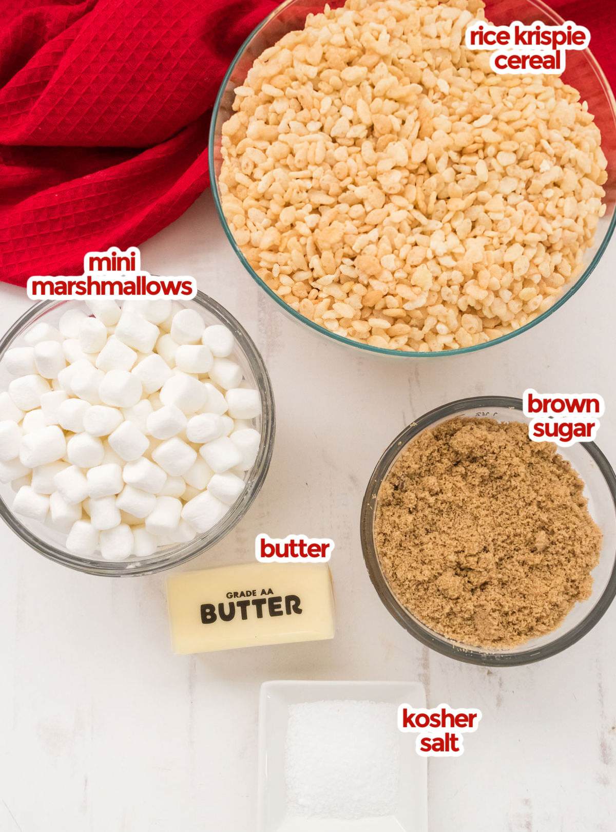 All the ingredients you will need to make the Salted Caramel Rice Krispie Treats including Rice Krispie Cereal, Mini Marshmallows, Brown Sugar, Butter and Kosher Salt.