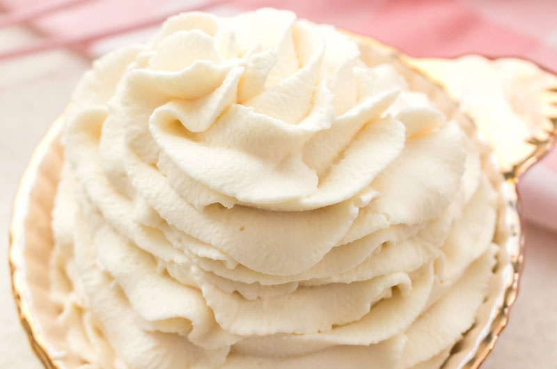 pink bowl filled with homemade whipped cream